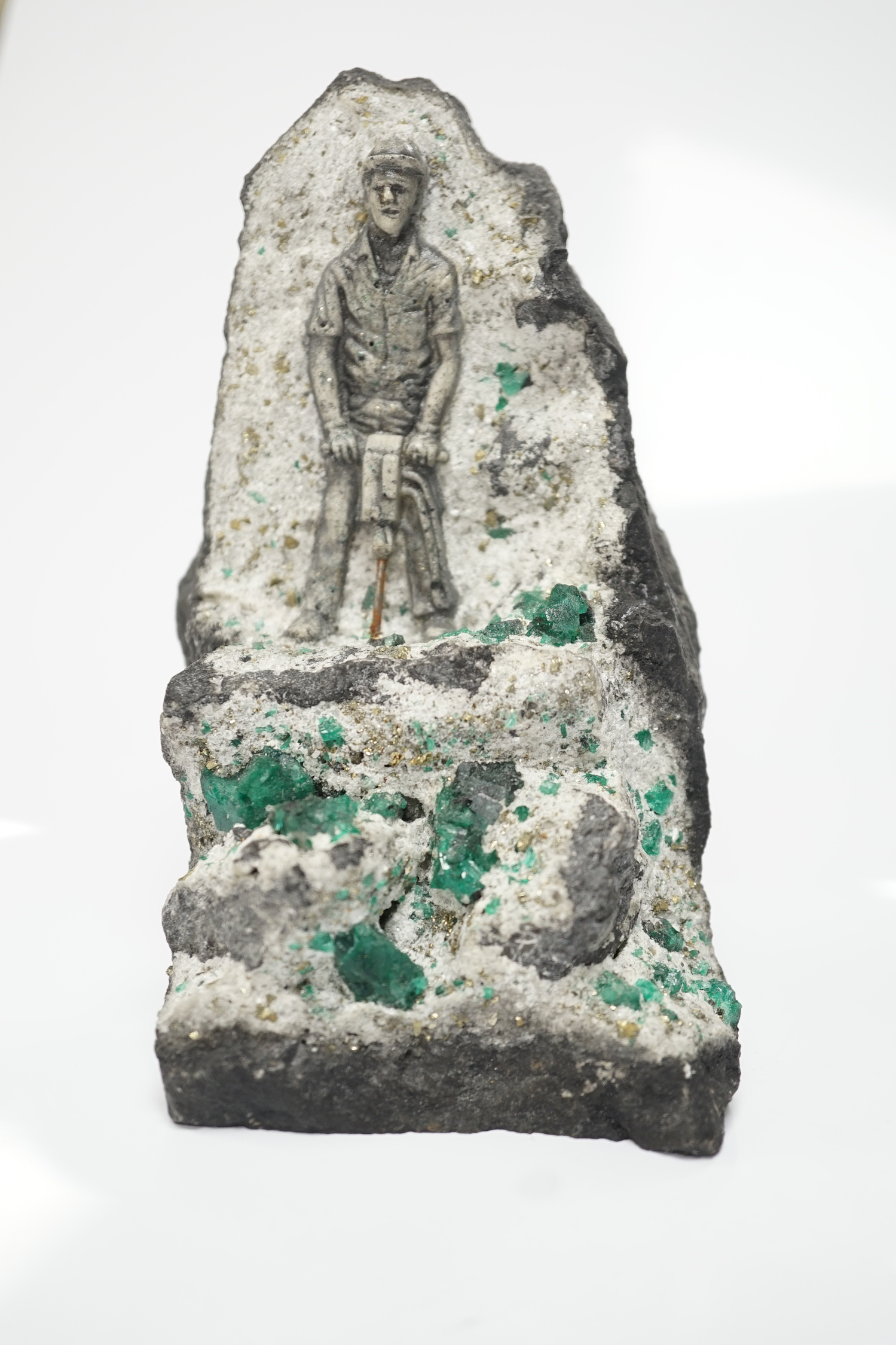 An iron pyrites and emerald? crystal figural geode sculpture, 14cm